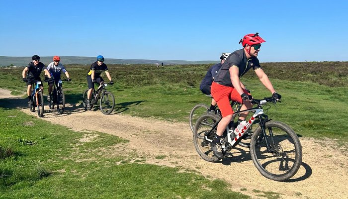 Bike riders racing through the countryside in the sun for the Bronte Off Road Bike Challenge