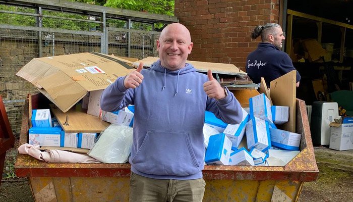 Sue Ryder volunteer, David, giving the double thumbs up