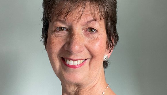A headshot of Dr Gale smiling at the camera.