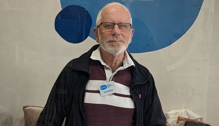 Sue Ryder shop volunteer, Ged, on the shop floor