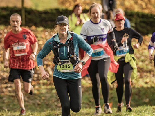 A large group of runners at the Run Bolton Abbey finishing line