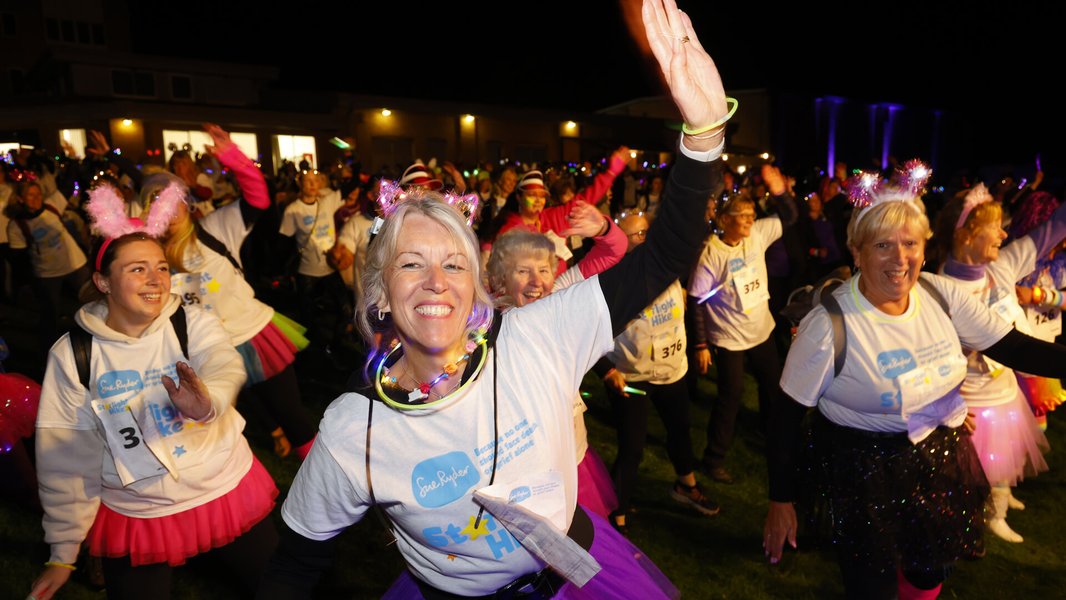 A large crowd of Starlight Hike walkers dancing during the Clubbercise warm up