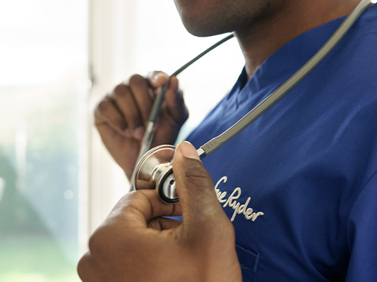 Close up of doctor placing stethoscope around his kneck