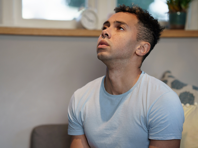 Young man looking up.